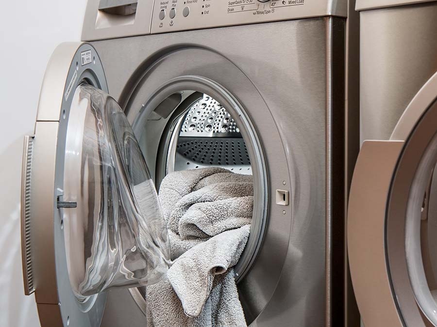 A washing machine releases microfibers from synthetic clothing. (Otay Water District)